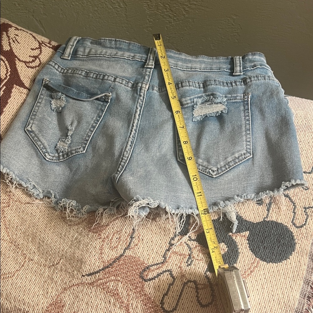 #1010+ Distressed Light Blue Denim Shorts - Picture 3 of 7